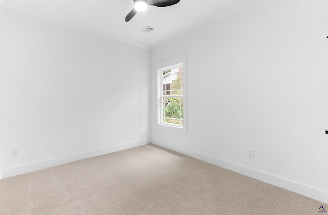 unfurnished room with light carpet, baseboards, a ceiling fan, and ornamental molding