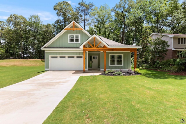 view of front of home with driveway, a garage, covered porch, a front yard, and board and batten siding