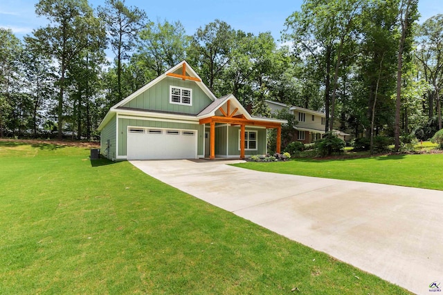 view of front of house with board and batten siding, a garage, concrete driveway, and a front yard