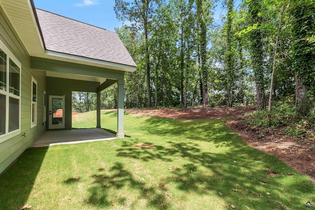 view of grassy yard featuring a patio