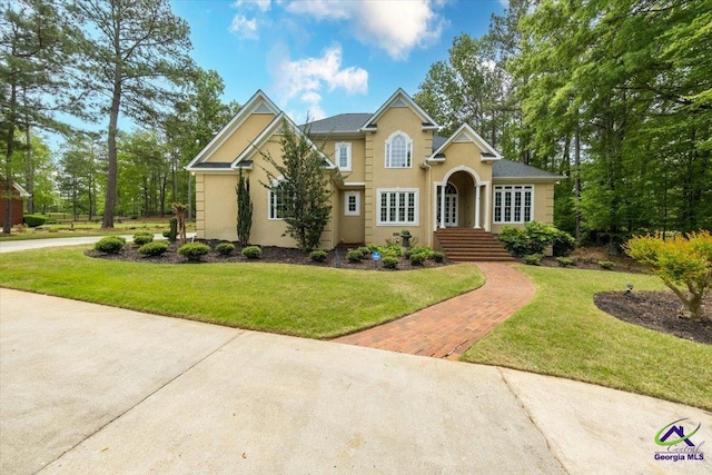160 Barrington Hall Dr, Macon, GA 31220 - view of front facade featuring stucco siding and a front lawn