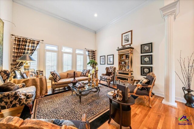 160 Barrington Hall Dr, Macon, GA 31220 - living room with crown molding, decorative columns, recessed lighting, light wood finished floors, and baseboards
