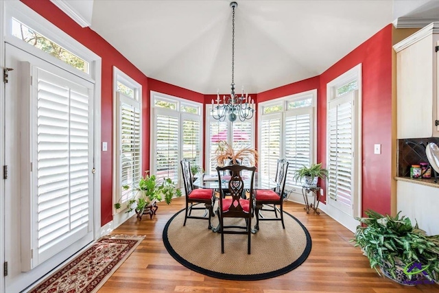 160 Barrington Hall Dr, Macon, GA 31220 - dining room featuring light wood-style floors, an inviting chandelier, baseboards, and plenty of natural light