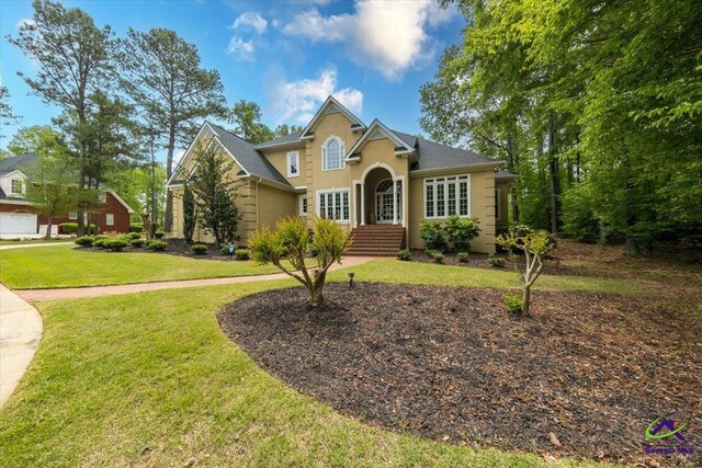 160 Barrington Hall Dr, Macon, GA 31220 - traditional-style home with a front yard and stucco siding