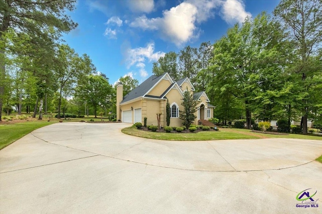 160 Barrington Hall Dr, Macon, GA 31220 - view of front of home with a front lawn, stucco siding, a garage, and concrete driveway