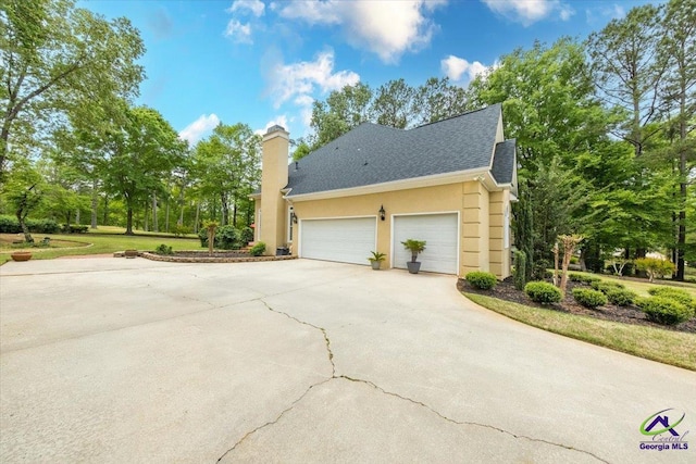160 Barrington Hall Dr, Macon, GA 31220 - view of home's exterior featuring concrete driveway, an attached garage, and stucco siding