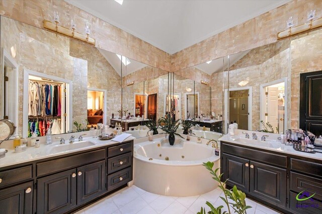 160 Barrington Hall Dr, Macon, GA 31220 - full bathroom with tile patterned floors, a sink, a whirlpool tub, and vaulted ceiling