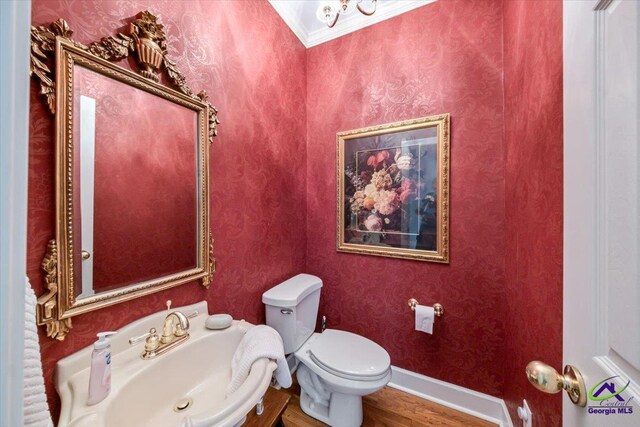 160 Barrington Hall Dr, Macon, GA 31220 - half bath with ornamental molding, toilet, wood finished floors, a sink, and baseboards
