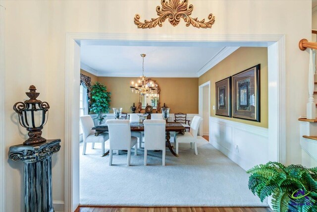 160 Barrington Hall Dr, Macon, GA 31220 - dining space featuring crown molding, carpet, and a notable chandelier
