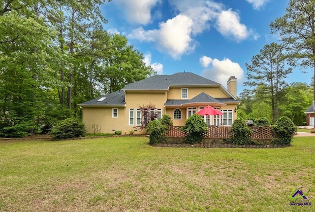 160 Barrington Hall Dr, Macon, GA 31220 - back of house featuring stucco siding, a chimney, and a lawn