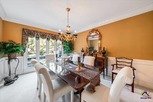 160 Barrington Hall Dr, Macon, GA 31220 - dining room featuring a notable chandelier, light colored carpet, ornamental molding, and a wainscoted wall