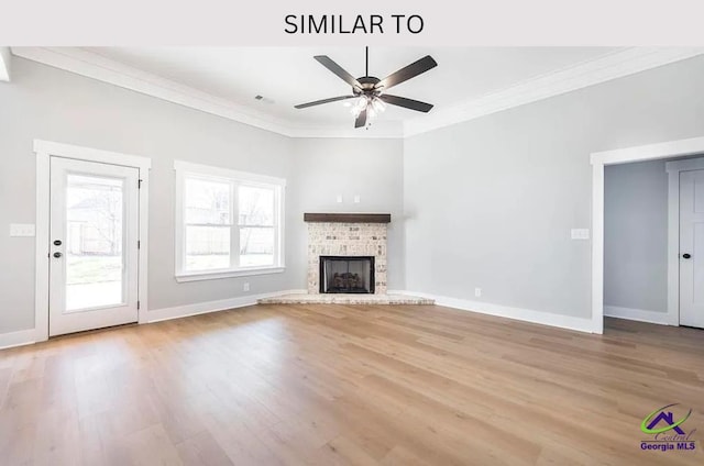 104 Reedy Ct, Perry, GA 31069 - unfurnished living room featuring crown molding, light wood-type flooring, a ceiling fan, baseboards, and a fireplace