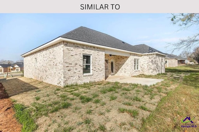 104 Reedy Ct, Perry, GA 31069 - back of property with a patio and brick siding