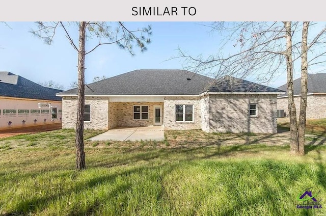 104 Reedy Ct, Perry, GA 31069 - rear view of property featuring a patio, brick siding, central AC unit, and a lawn