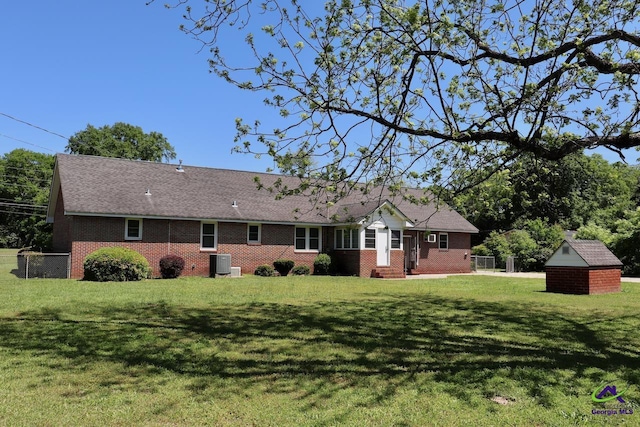 5864 Porterfield Cir, Macon, GA 31216 - back of property with brick siding and a storage unit