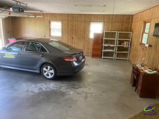 5864 Porterfield Cir, Macon, GA 31216 - garage with wooden walls and a garage door opener