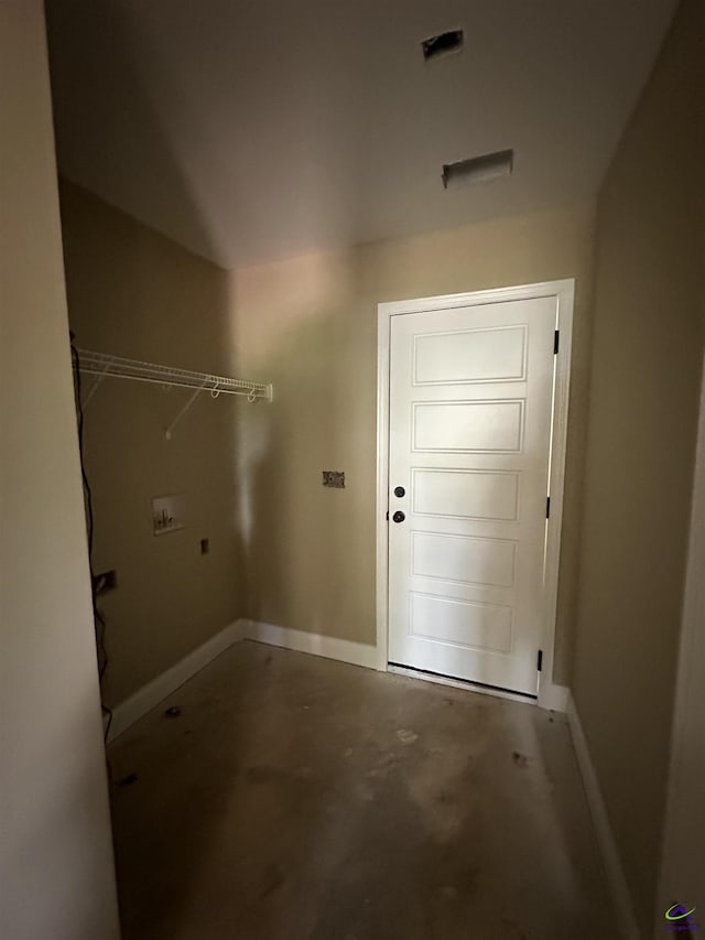 washroom with baseboards and washer hookup
