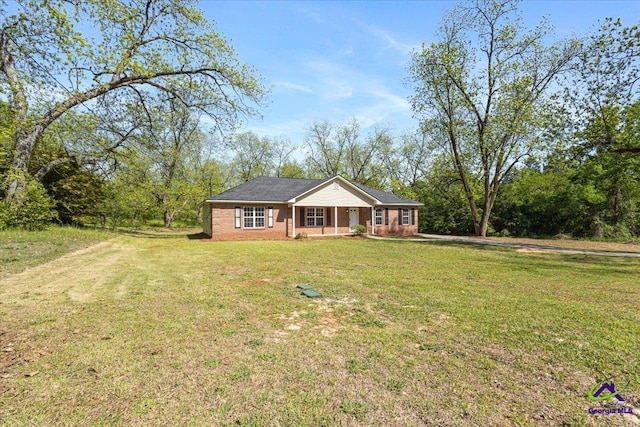 single story home featuring a front lawn, brick siding, and covered porch