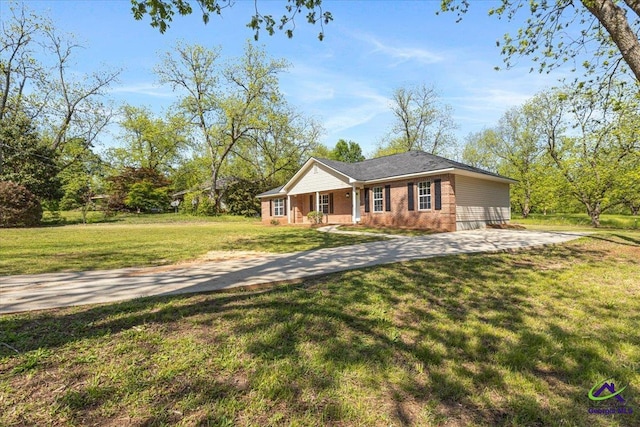 ranch-style house featuring a porch and a front yard