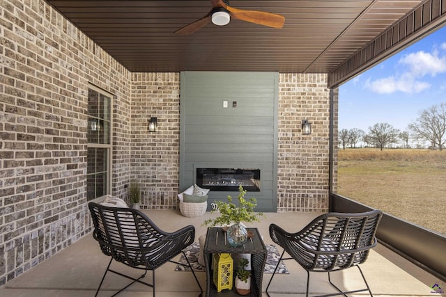 view of patio / terrace with outdoor lounge area and a ceiling fan