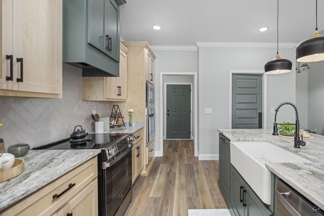 kitchen featuring stainless steel appliances, light brown cabinets, ornamental molding, and tasteful backsplash