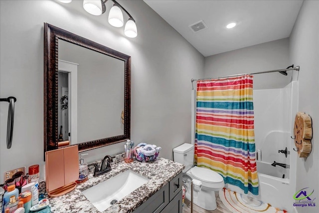 bathroom with shower / tub combo with curtain, visible vents, toilet, and vanity