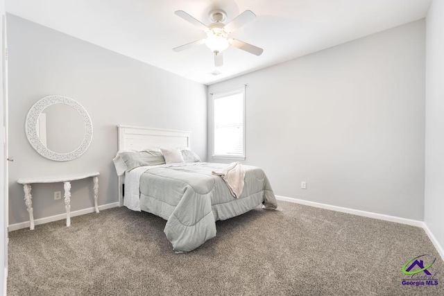 carpeted bedroom with baseboards and ceiling fan