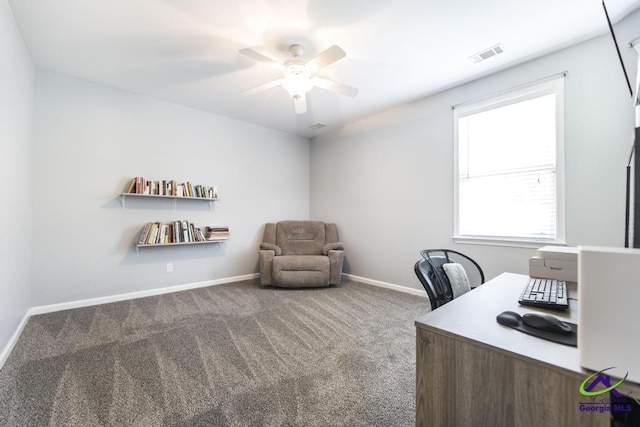 carpeted home office with baseboards, visible vents, and ceiling fan