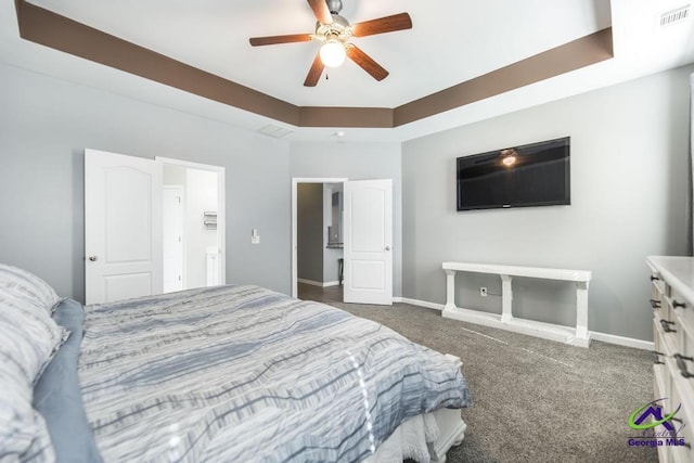 carpeted bedroom featuring visible vents, baseboards, and ceiling fan