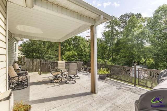 view of patio featuring a fenced backyard and outdoor dining space