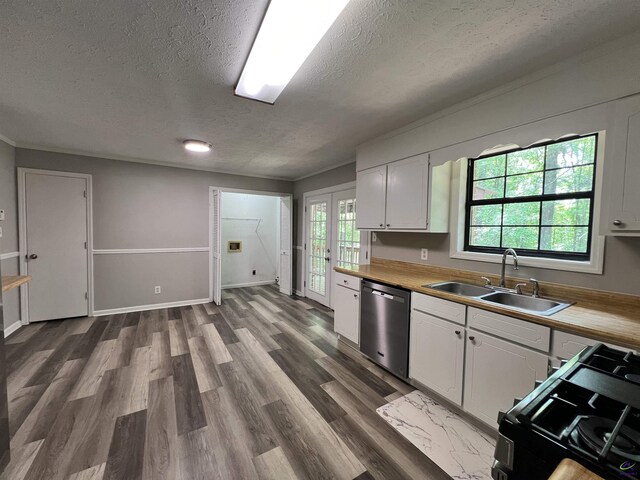 2045 Greentree Pkwy, Macon, GA 31220 - kitchen featuring stainless steel dishwasher, black gas stove, a sink, a textured ceiling, and white cabinets