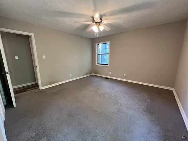 2045 Greentree Pkwy, Macon, GA 31220 - spare room with ceiling fan, baseboards, dark colored carpet, and a textured ceiling