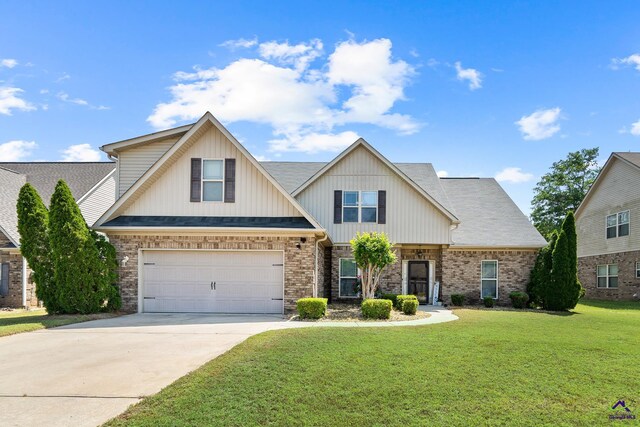 craftsman-style house featuring brick siding, driveway, a garage, and a front yard