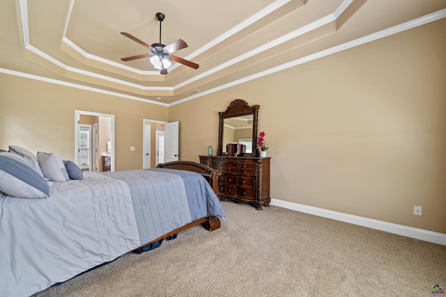 bedroom featuring light carpet, a tray ceiling, baseboards, ceiling fan, and ornamental molding