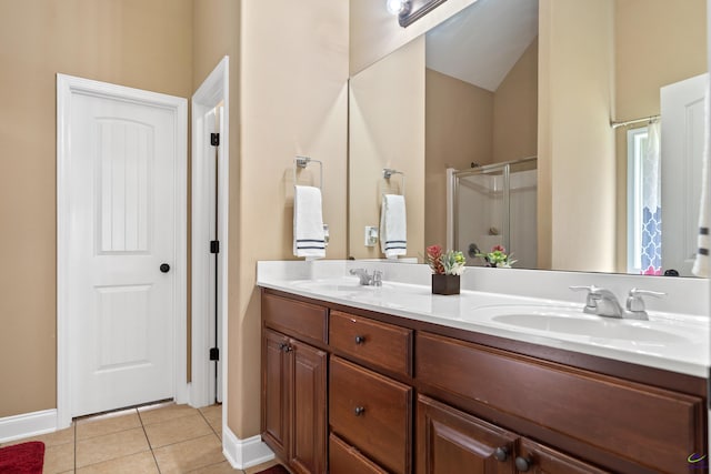 full bathroom featuring tile patterned floors, a sink, double vanity, and a stall shower