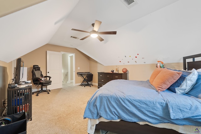 bedroom with vaulted ceiling, visible vents, a ceiling fan, and light carpet