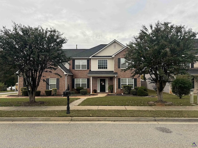 101 Bryce Dr, Warner Robins, GA 31088 - traditional-style home with brick siding and a front lawn