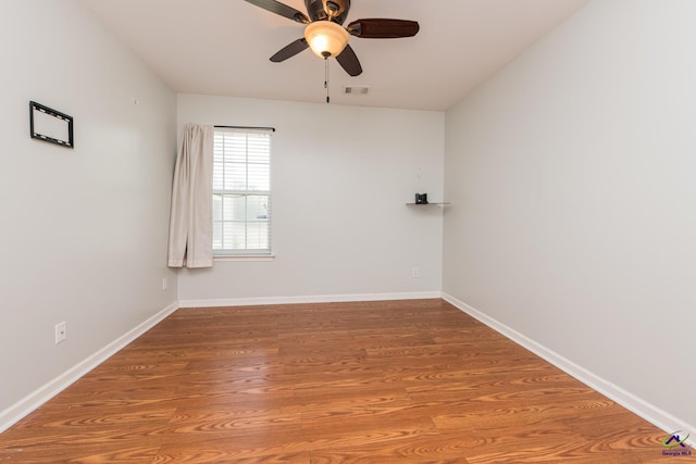 101 Bryce Dr, Warner Robins, GA 31088 - spare room featuring visible vents, ceiling fan, wood finished floors, and baseboards