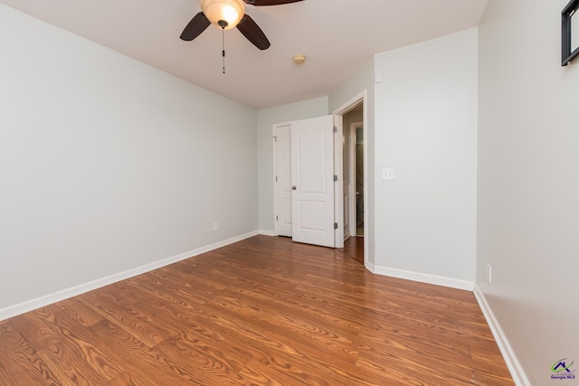 101 Bryce Dr, Warner Robins, GA 31088 - unfurnished bedroom featuring a ceiling fan, wood finished floors, and baseboards