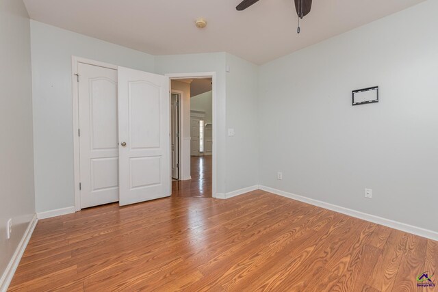 101 Bryce Dr, Warner Robins, GA 31088 - unfurnished bedroom with baseboards, ceiling fan, and light wood-style floors