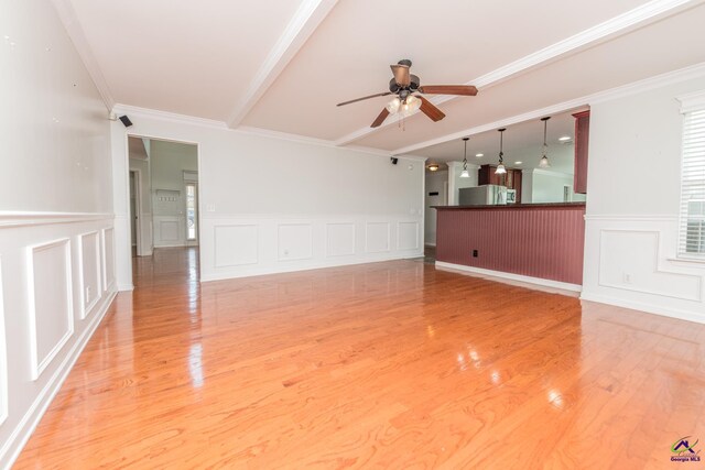 101 Bryce Dr, Warner Robins, GA 31088 - spare room with a ceiling fan, light wood finished floors, and a decorative wall