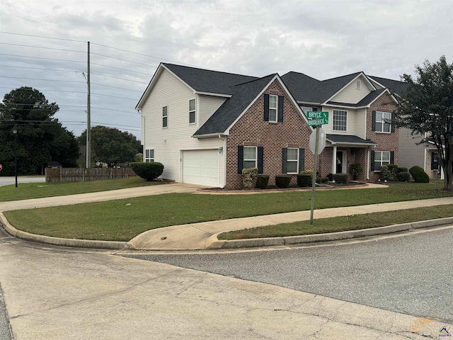 101 Bryce Dr, Warner Robins, GA 31088 - traditional-style home with a front yard, a garage, driveway, brick siding, and fence