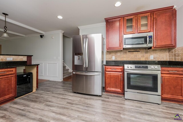 101 Bryce Dr, Warner Robins, GA 31088 - kitchen featuring appliances with stainless steel finishes, wine cooler, decorative backsplash, and ornamental molding