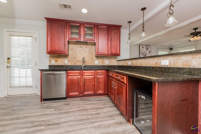 101 Bryce Dr, Warner Robins, GA 31088 - kitchen with beverage cooler, dark brown cabinets, dishwasher, a sink, and visible vents