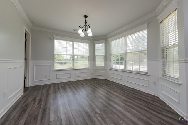 101 Bryce Dr, Warner Robins, GA 31088 - unfurnished dining area featuring an inviting chandelier, a decorative wall, ornamental molding, and dark wood-style floors