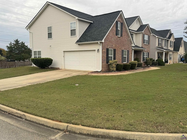 101 Bryce Dr, Warner Robins, GA 31088 - traditional-style home featuring concrete driveway, a front lawn, fence, a garage, and brick siding
