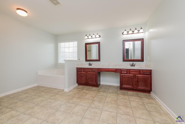 101 Bryce Dr, Warner Robins, GA 31088 - full bathroom with double vanity, visible vents, a bath, and a sink