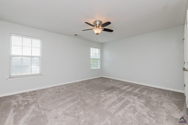 101 Bryce Dr, Warner Robins, GA 31088 - unfurnished room with carpet, visible vents, a ceiling fan, and baseboards