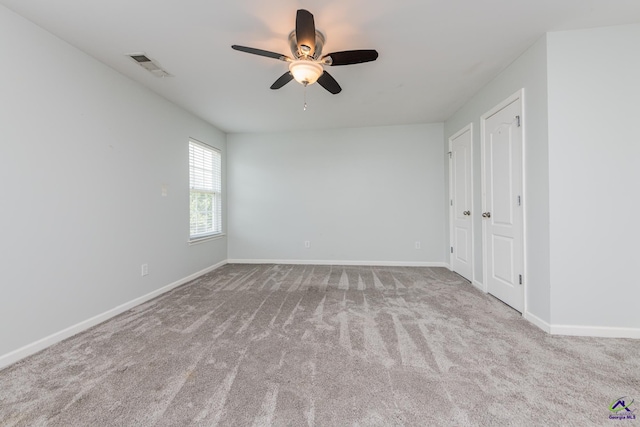 101 Bryce Dr, Warner Robins, GA 31088 - unfurnished room featuring visible vents, a ceiling fan, baseboards, and carpet floors