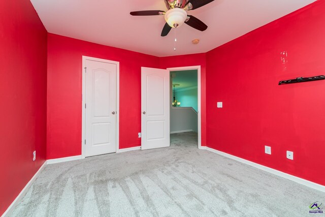 101 Bryce Dr, Warner Robins, GA 31088 - unfurnished bedroom featuring ceiling fan, carpet, and baseboards